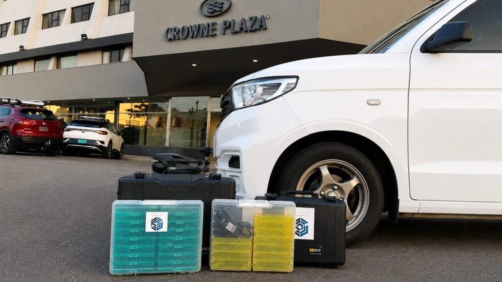Professional deployment of temporary Motorola communication systems outside Crowne Plaza Costa Rica, including transport vehicle, Pelican equipment cases and organized operational kits prepared for mission-critical communications.